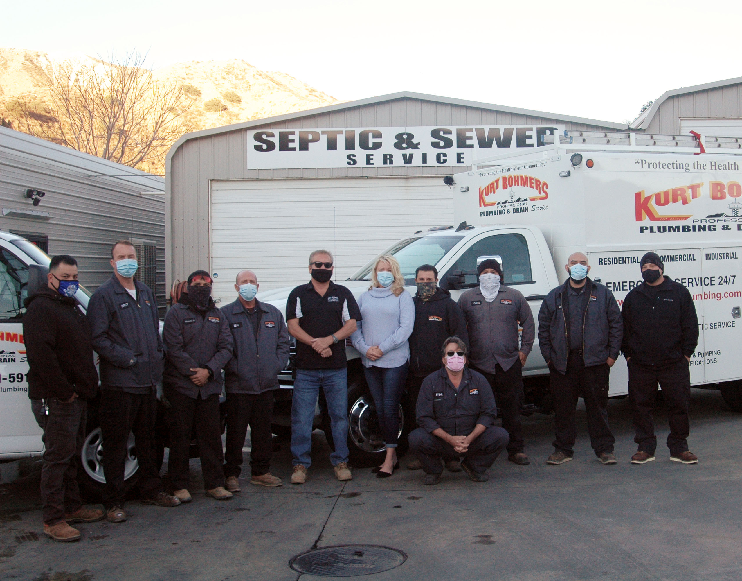 Kurt Bohmers Plumbing team photo standing in front of truck