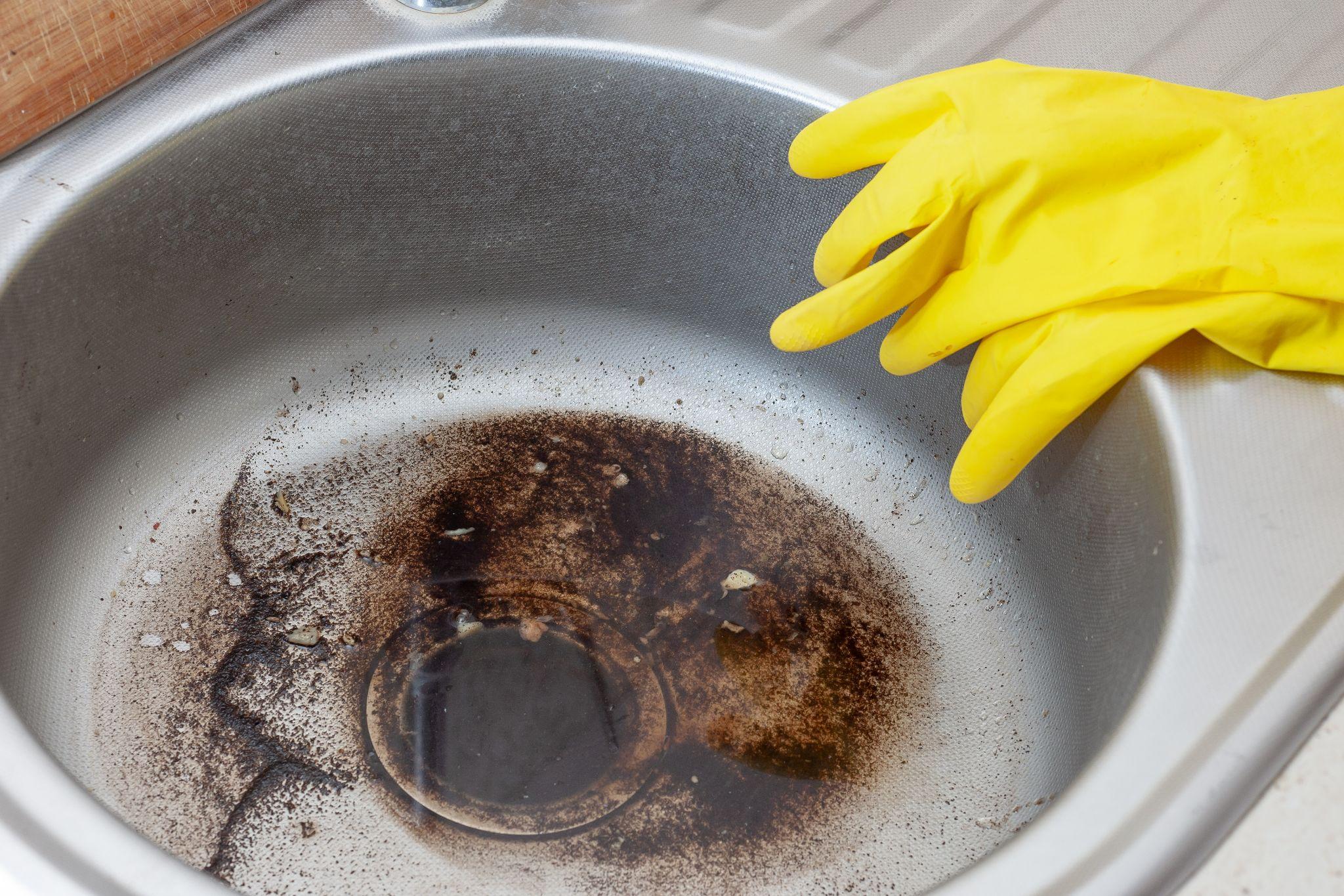 Dirty Sink at kitchen room. Clean a sink drain. unclog a kitchen sink without a disposal